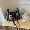 Bolsa Tote para Deslocamento Transfronteiriço Bolsa Feminina 2026 Nova Popular Elegante Bolsa de Ombro Único Grande Capacidade de Mão para Axila