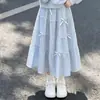 Conjunto de dos piezas para niña: una sudadera con cuello de muñeca y una falda midi de moda con lazo, perfecta para principios de otoño, adecuada para la escuela