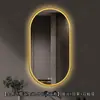 Espejo de baño inteligente ovalado en stock con lijado exterior e iluminación LED translúcida, adecuado para montaje en pared de baño y proyectos hoteleros, con opciones de personalización.