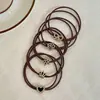Nuevas diademas de alta gama 2026 para mujer, ligas de goma, cordones para el pelo, anillos para el pelo, cubiertas de cuero, accesorios para el pelo de niña con un toque de sofisticación