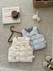 Chaleco de plumón para bebé 2026 nuevo y elegante modelo de otoño e invierno para niños y niñas, chaqueta interior de bebé hecha de plumón de pato blanco