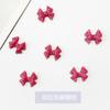 Joyería para uñas de lazo Libro Rojo Pequeño Mismo estilo Aceite que gotea Corazón de dragón Lazo Chica dulce Decoraciones para uñas al por mayor