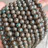 Cuentas de ágata natural de fútbol al por mayor cuentas de fútbol verdes Xizang suministro directo de fabricantes de accesorios de joyería DIY