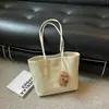 Bolsa de tecido trançado de grande capacidade, estilo nicho, para mulheres, coleção outono 2026, bolsa de ombro, adequada para estudantes universitários, para uso em sala de aula e como bolsa de compras de uso diário