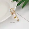 Pin de cintura para pantalones artefacto de cintura para fijar ropa cárdigan de punto para mujer botón anti-luz al por mayor broche de perla
