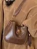 Bolso de Axila de Aspecto Retro de Alta Calidad para Mujer 2025 Nuevo Bolso Cubo Simple Textura de Nicho Hombro Único Cruzado Bolso para Teléfono Móvil