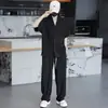 Conjunto deportivo casual de dos piezas con textura de moda estilo americano para hombres y mujeres, camiseta de manga corta holgada de verano talla grande y pantalones largos