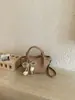 Bolso Pequeño de Alta Gama Elegante Transfronterizo 2026 Nueva Versión Coreana Bolso para Mujer Versátil de Moda Bolso Cruzado Bolso de Mano Bolso Cubo