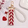 Llavero Colgante de Cinta Bordada Hoja Nueva Accesorios Creativos de Aleación de Carpa Par de Fundas para Auriculares Decoración de Bolsos