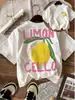 Diseñada con Tejido Ligero y Transpirable, Ropa Casual de Primavera y Verano para Mujer, Camiseta con Estampado de Limones - Cuello Redondo Casual, Estilo Europeo y Americano