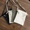 2026 Bolsa de Celular Lona Ultrafina Bolsa Pequena Estilo Minimalista Transversal Porta-Moedas Unissex Bolsa de Celular Bolsa de Ombro