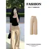 Conjunto de otoño para mujer con top negro de manga media y pantalones de traje caqui, nuevo estilo 2026, atuendo de principios de otoño estilo "old money"