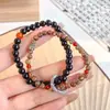 Pulsera de tinta de humo seis nuevas pulseras de cuentas agrietadas de hielo chinas pulsera de anillo de correr de nicho de alta gama de moda para hombre