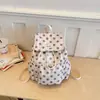 Mochila com cordão de bolinhas de alta moda transfronteiriça para mulheres, bolsa de estudante estilo faculdade, mochila casual de nicho para viagem