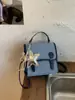 Mochila de viaje transfronteriza estilo universitario para mujer, nuevo modelo de verano 2026, bolso de mano casual versátil de alta gama niche