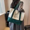 Bolsa de Lona Portátil de Gran Capacidad para Mujer 2024 Nueva Casual Versátil Estudiante Linda Bolsa Simple Bolsa de Compras