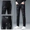 Jeans Negros con Salpicaduras y Parches Rasgados para Hombre Estilo High Street de Hong Kong Corte Delgado Marca de Moda Graffiti Estilo Europeo Pantalones Largos