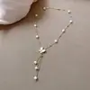 Collar de acero de titanio con perlas de agua dulce, ligero, de lujo, con borlas de fritillaria y mariposa, elegante cadena de clavícula con perlas de agua dulce de celebridades de Internet para mujer