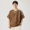 Top com padrão de losangos, novo estilo verão 2026, fresco e solto, estampado, gola redonda, manga curta, camiseta masculina versátil e moderna