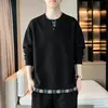 Sudadera falsa de dos piezas con cuello Henry para hombre, otoño 2026, corte holgado estilo American high street, top de camiseta de manga larga a cuadros patchwork, moderno