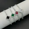 Nuevo Pulsera de Broche de Cuatro Hojas Redondo Completamente Diamantado Micro Pavé de Circonita Cadena de Tenis Diseño de Nicho