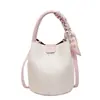 Bolso de mano tipo cubo con patrón de lichi de alto valor estético para mujer, Bolso bandolera de cuero suave, Nuevo de moda Verano 2026
