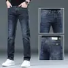 Jeans de hombre de alta gama, forrados de felpa y engrosados, nuevos pantalones rectos ajustados de otoño e invierno 2026, pantalones largos elásticos lavados