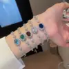Pulsera Colgante Ovalado Flor de Circonita Cúbica Estilo Coreano Lujo Ligero Sensación de Alta Gama Anillo de Mano Moda Exquisito Versátil Joyería de Mano Venta al por Mayor