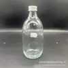 Garrafa de Vidro Transparente Redonda Sub-Garrafa Garrafa Vazia para Bebida de Água Mineral Atacado Pronto de Fábrica Pode Ser Impressa com Logo Embalagem