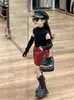 Otoño 2024 Nueva Ropa Infantil Coreana Niñas Spice Girls Cuello Alto Nudo en la Espalda Camiseta Básica Falda Corta Falda de Cuero