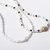Joyas de Venta Caliente Europeas y Americanas Estilo Étnico Bohemio Retro Colgante de Caracola Cuentas de Arroz Multicolor Juego de Collar de Dos Piezas
