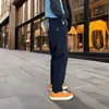 Pantalones casuales funcionales populares de otoño, nuevos para trabajo al aire libre, con etiqueta blanca pequeña, holgados y versátiles, estilo de alta costura moderno para hombres y mujeres, adecuados para parejas