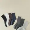 Calcetines Zhuji calcetines anti-pilling calcetines de color liso calcetines de algodón calcetines de tubo medio para hombre absorbentes del sudor transpirables medias para hombre calcetines de negocios simples
