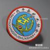Insignia escolar de Guangzhou marca tejida Insignia de ropa de fábrica marca registrada borde de bloqueo parte trasera termofusible gancho y bucle sello tejido marca escolar marca de jardín punto
