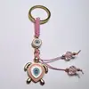 Colgante de Serie Ojo de Diablo Transfronterizo Europeo y Americano Colgante de Llavero de Joyería de Animales Ojo de Hueso con Goteo de Aceite Accesorios de Aleación para Mujeres