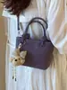 Bolsa Saco Versátil e Fashion para Mulheres 2026 Verão Novo Estilo Bolsa de Mão Texturizada Bolsa de Ombro Transversal Design de Nicho para o Dia a Dia