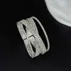 Nuevas joyas de estilo europeo y americano: Pulsera de alambre con strass cruzado de ocho filas, personalidad exagerada, estilo abierto, accesorio de muñeca para pareja de escenario B349