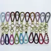 Venta al por mayor del fabricante Llavero de Cuerda de Aleación Tejida y Cuero Accesorios Colgantes Material PU Bolsas Pequeñas de Regalo Accesorios para Llaveros