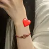 Pulsera de Pareja Flor Roja Pequeña Madera de Durazno Flor Pequeña Cuerda de Mano Femenina Nicho Tejida a Mano Cuerda Roja Regalo