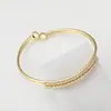 Pulsera de cobre con incrustaciones de circonita de fábrica directa transfronteriza para mujer, pulsera geométrica abierta avanzada estilo Ins, joyería, joyería europea y americana