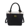 Bolsa de cubo portátil de alta gama al por mayor para mujer, nuevo estilo de invierno 2025, empalme, bolso de hombro de lujo ligero, bolso cruzado versátil de moda