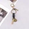 Accesorios para llaveros hechos a mano cierre de langosta cuerda de cuero versátil retro llavero colgante para llavero semiacabado