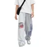 Pantalones de chándal anchos asimétricos de moda estilo americano 2026, unisex, corte holgado, tela fluida, para streetwear casual y pantalones deportivos
