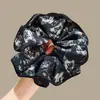 Goma para el pelo de lunares florales de hada atmosférica para mujer, estilo coreano, nicho, cuerda para el pelo, flor de pelo elegante