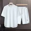 Traje de verano para hombre, moderno, holgado, de manga corta, conjunto de dos piezas, elegante, deportivo informal de alta gama.