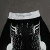 Pantalones casuales unisex de estilo retro de alta calle con bordado e impresión de notas musicales, cintura elástica, adecuados para el uso diario
