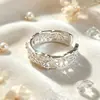 Anillo de encaje de plata de ley 925 para mujer, diseño hueco de nicho vintage francés con circonita brillante, lujo ligero con un toque de alta gama, anillo abierto estilo ins