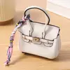 Mini bolso platino, charm para bolso de mujer, accesorio de llavero de coche lindo y creativo, bolsa para auriculares, bolsa para lápiz labial, bolso tipo cubo