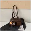 Moda transfronteriza diseño de doble bolsillo bolsa de boliche para mujer nuevo tacto de alta gama bolsa de almohada de una sola pieza bolsa de axila retro moderna