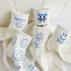 Calcetines para Mujer en Otoño e Invierno Estilo Nuevo Caricatura Cara Sonriente Calcetines de Algodón de Media Pantorrilla para Mujer Son Cómodos, Absorbentes del Sudor, Transpirables y Versátiles para Estilo Campus de Niñas